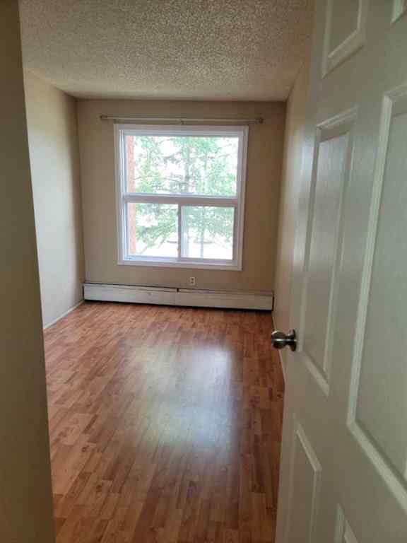 MLS® A2084617 - Unit #209 1712 38 Street SE in Forest Lawn Calgary, Residential
