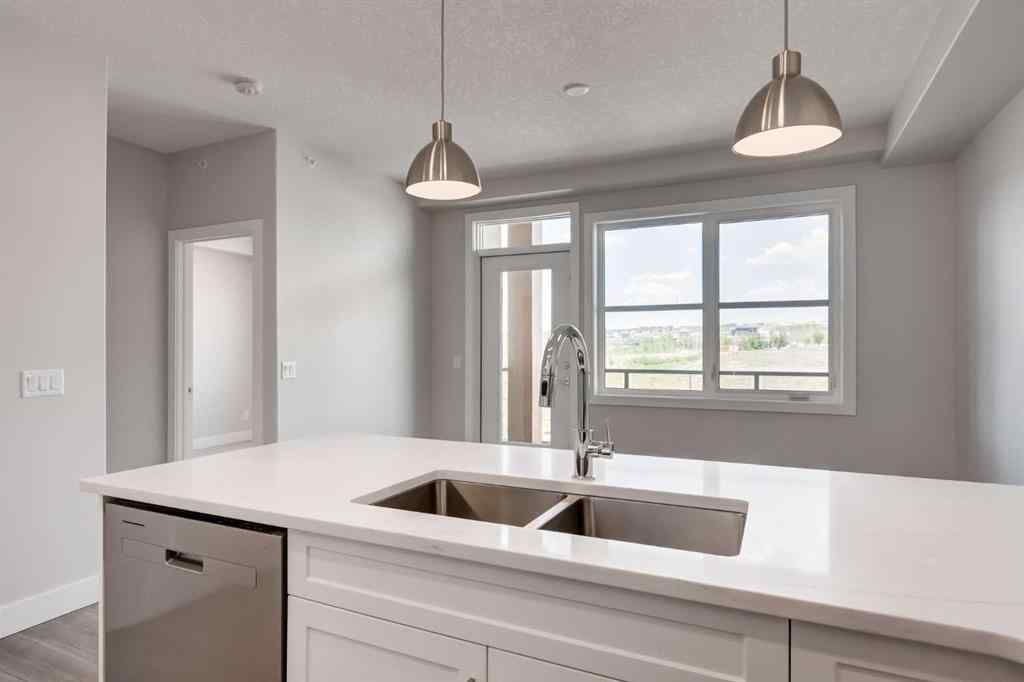 MLS® A2189418 - Unit #210 175 Wolf Hollow Crescent SE in Wolf Willow Calgary, Residential