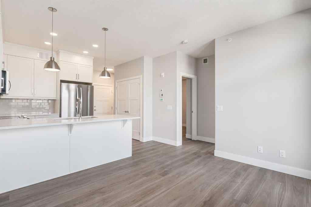 MLS® A2189418 - Unit #210 175 Wolf Hollow Crescent SE in Wolf Willow Calgary, Residential