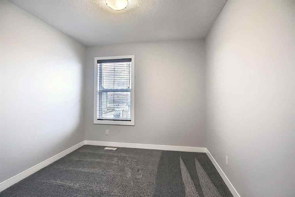 MLS® A2193822 - 322 Sundown Road  in Sunset Ridge Cochrane, Residential