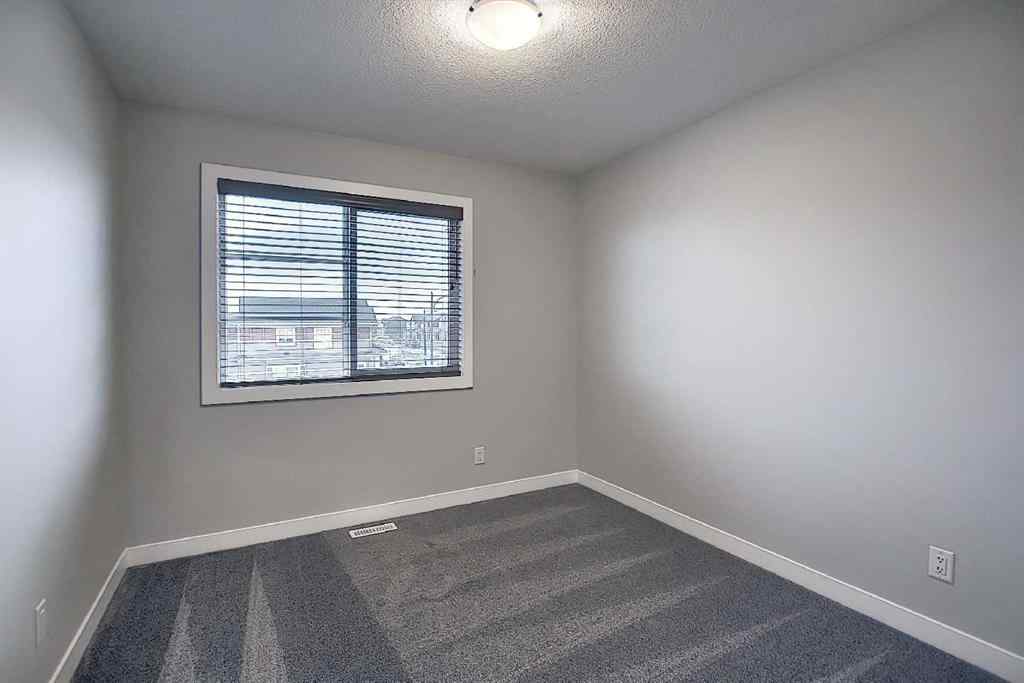 MLS® A2193822 - 322 Sundown Road  in Sunset Ridge Cochrane, Residential