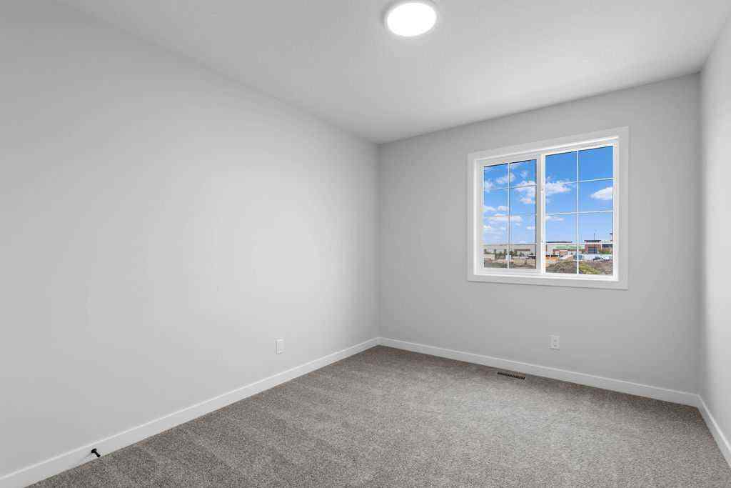 MLS® A2199712 - 1025 Reynolds Crescent SW in Coopers Crossing Airdrie, Residential