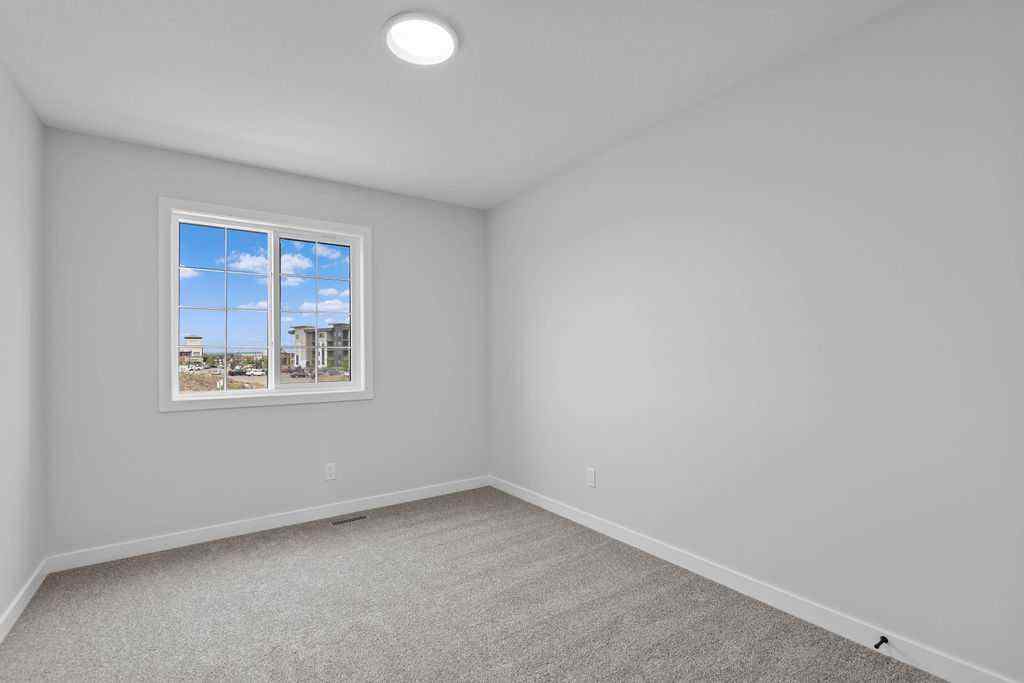 MLS® A2199712 - 1025 Reynolds Crescent SW in Coopers Crossing Airdrie, Residential