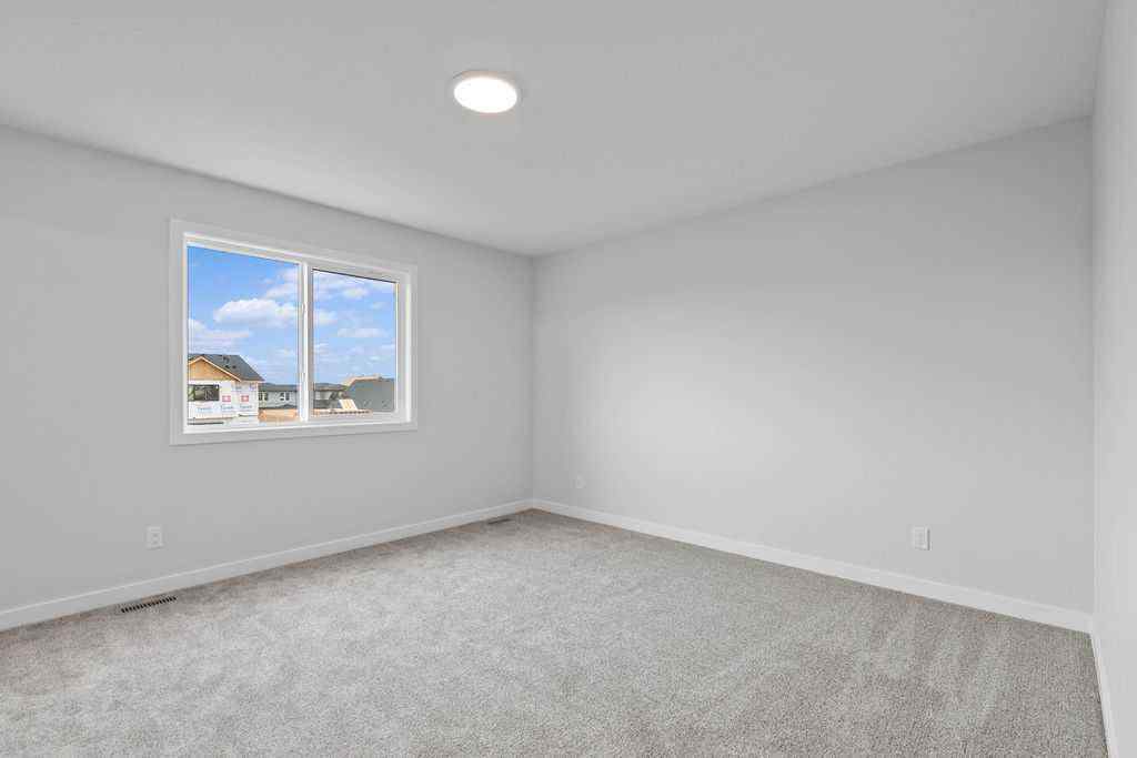 MLS® A2199712 - 1025 Reynolds Crescent SW in Coopers Crossing Airdrie, Residential