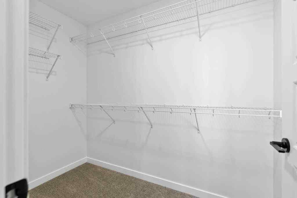 MLS® A2201126 - 1037 Reynolds Crescent SW in Coopers Crossing Airdrie, Residential