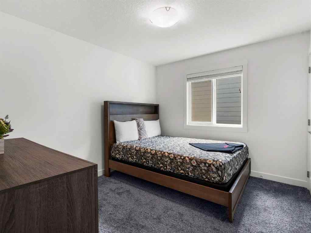MLS® A2206366 - 18 West Grove Mews SW in West Springs Calgary, Residential