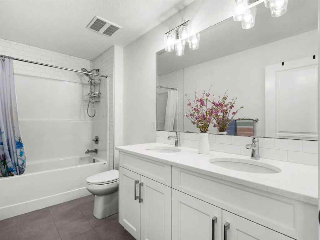 MLS® A2206366 - 18 West Grove Mews SW in West Springs Calgary, Residential