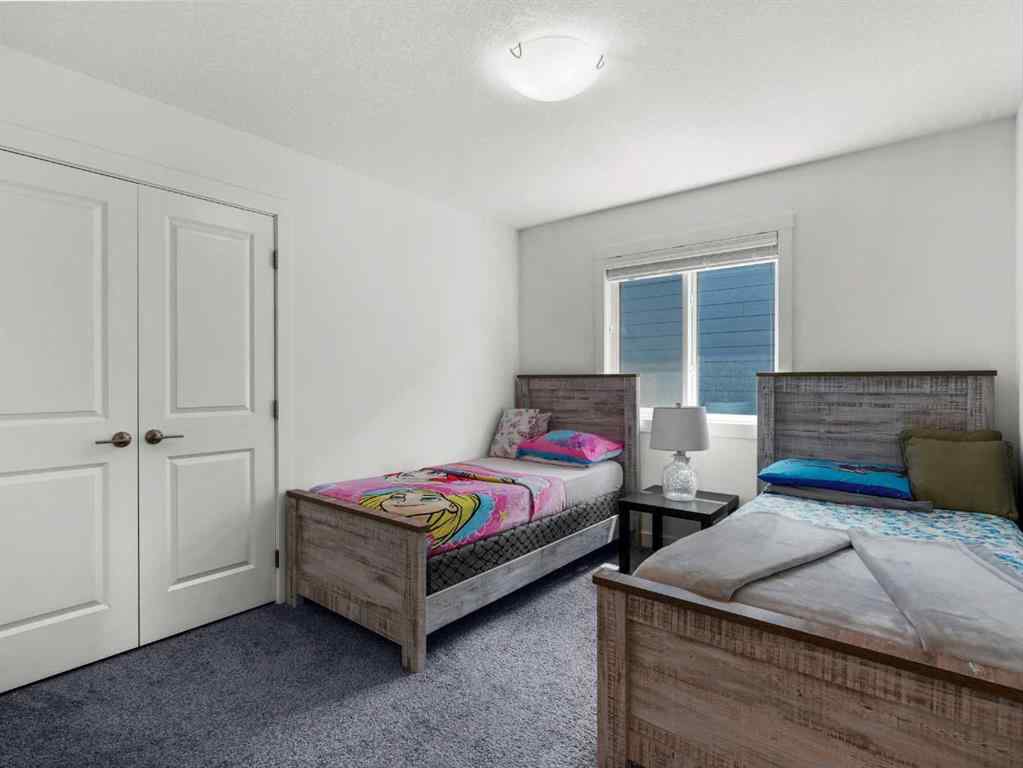 MLS® A2206366 - 18 West Grove Mews SW in West Springs Calgary, Residential