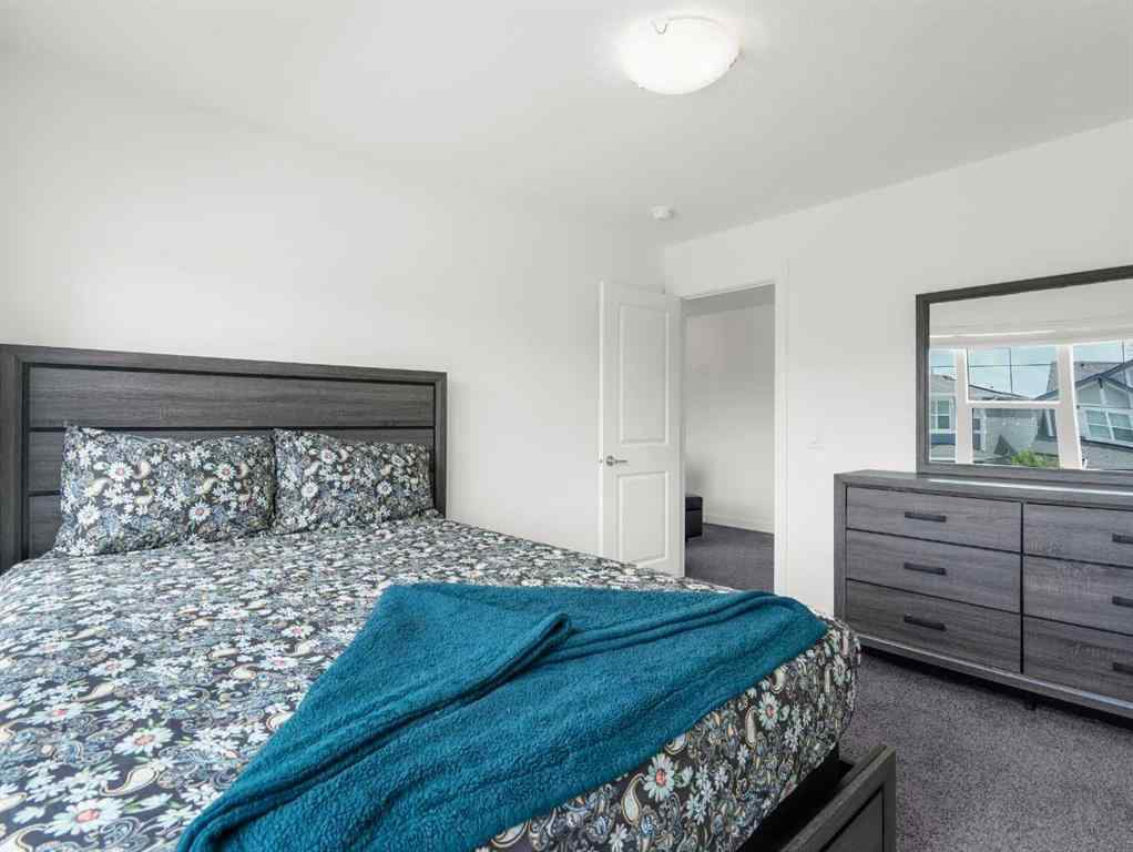 MLS® A2206366 - 18 West Grove Mews SW in West Springs Calgary, Residential