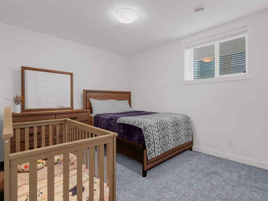 MLS® A2206366 - 18 West Grove Mews SW in West Springs Calgary, Residential