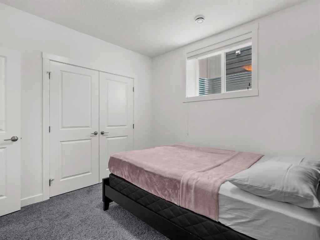 MLS® A2206366 - 18 West Grove Mews SW in West Springs Calgary, Residential