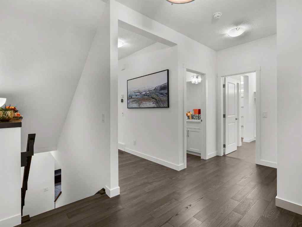 MLS® A2206366 - 18 West Grove Mews SW in West Springs Calgary, Residential