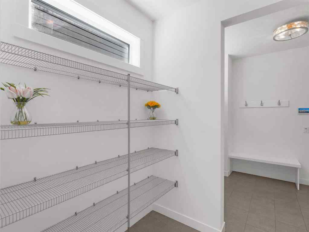 MLS® A2206366 - 18 West Grove Mews SW in West Springs Calgary, Residential