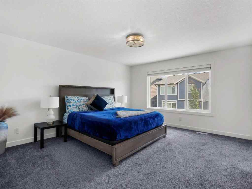 MLS® A2206366 - 18 West Grove Mews SW in West Springs Calgary, Residential
