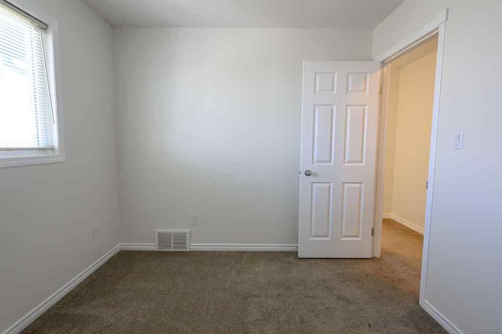 MLS® A2206483 - 11402 82 Avenue  in Westpointe Grande Prairie, Residential