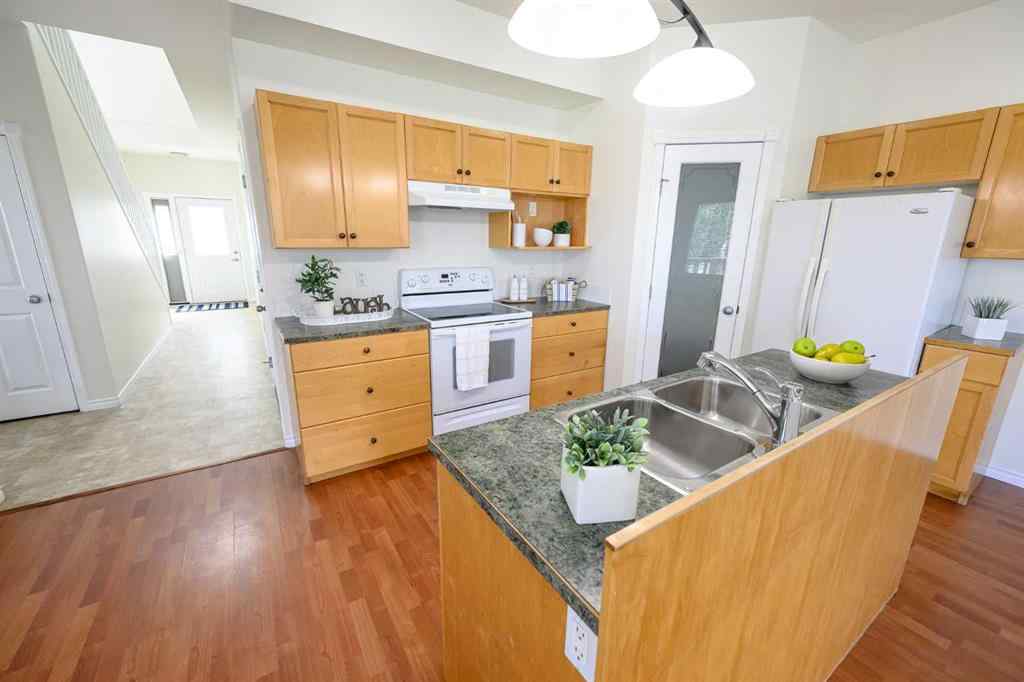 MLS® A2206483 - 11402 82 Avenue  in Westpointe Grande Prairie, Residential