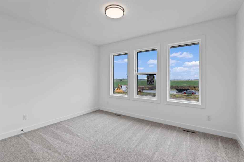 MLS® A2207007 - 1313 South Point Parade SW in South Point Airdrie, Residential