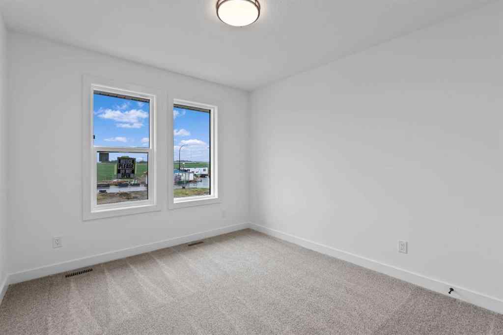 MLS® A2207007 - 1313 South Point Parade SW in South Point Airdrie, Residential