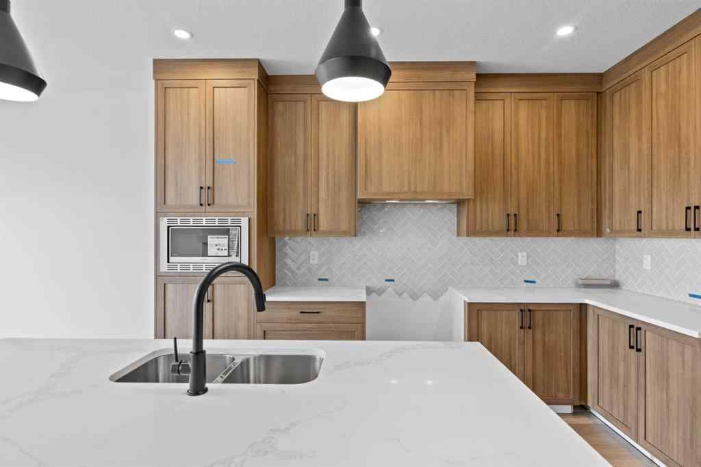 MLS® A2207007 - 1313 South Point Parade SW in South Point Airdrie, Residential