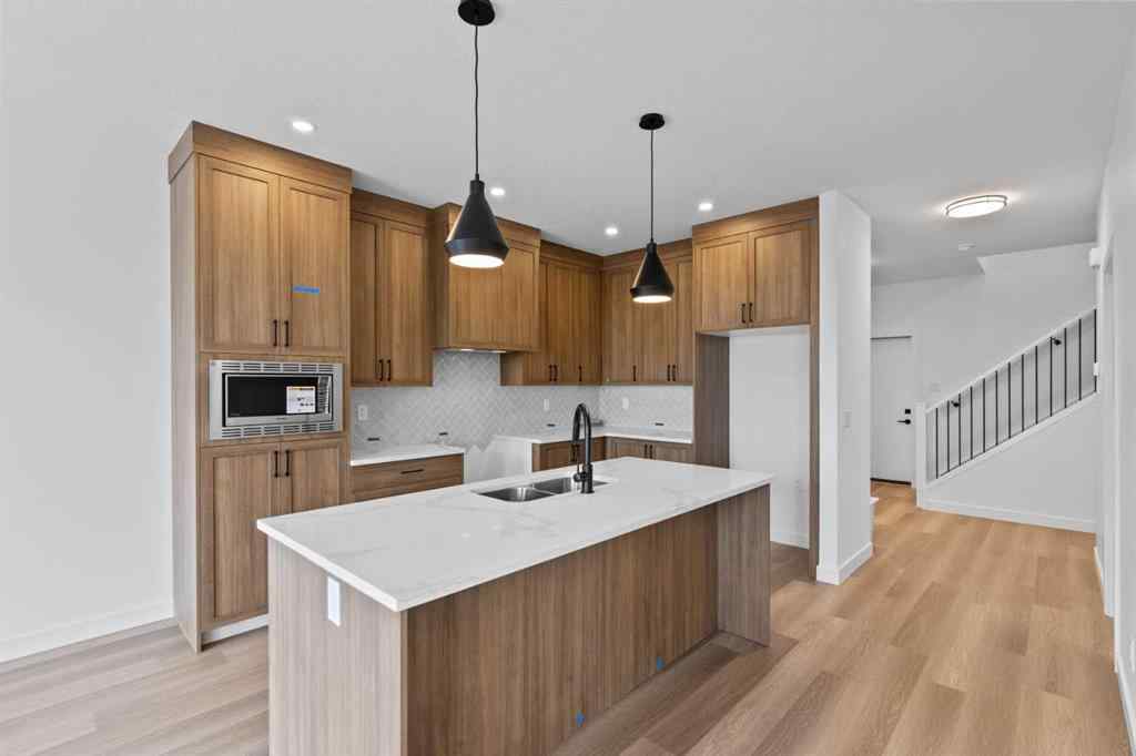 MLS® A2207007 - 1313 South Point Parade SW in South Point Airdrie, Residential