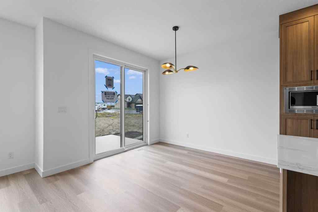 MLS® A2207007 - 1313 South Point Parade SW in South Point Airdrie, Residential