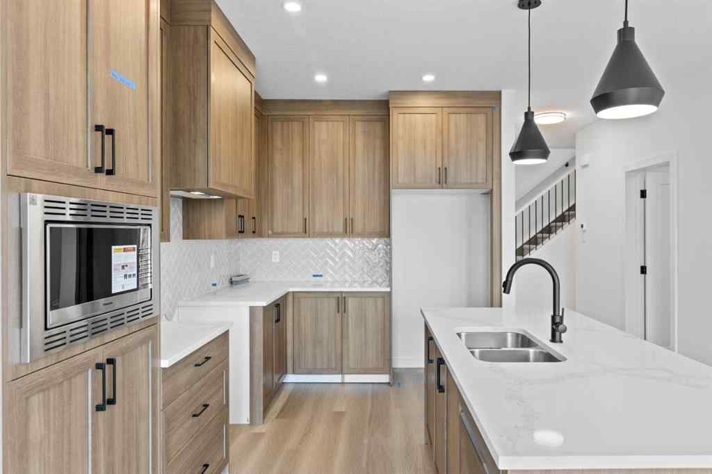 MLS® A2207007 - 1313 South Point Parade SW in South Point Airdrie, Residential
