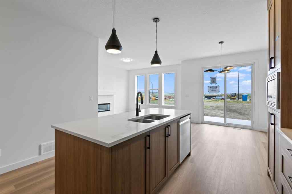 MLS® A2207007 - 1313 South Point Parade SW in South Point Airdrie, Residential