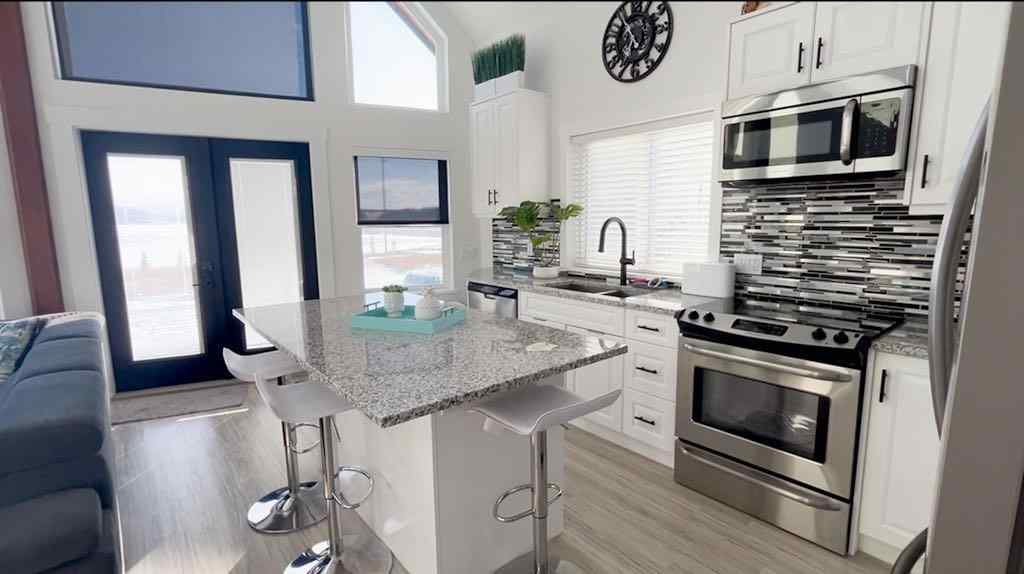 MLS® A2207399 - 456 Cottageclub Cove  in Cottage Club at Ghost Lake Rural Rocky View County, Residential