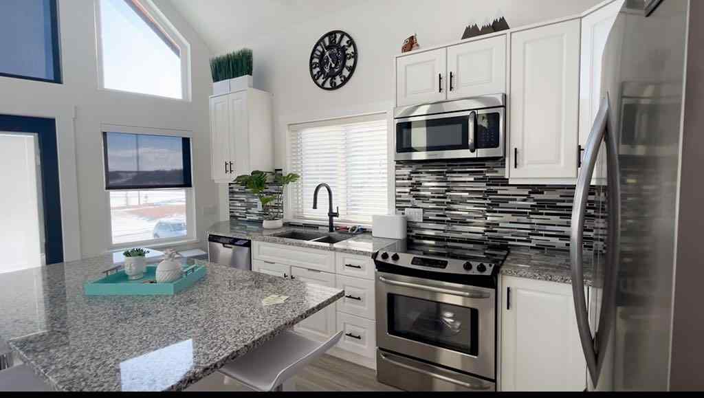 MLS® A2207399 - 456 Cottageclub Cove  in Cottage Club at Ghost Lake Rural Rocky View County, Residential