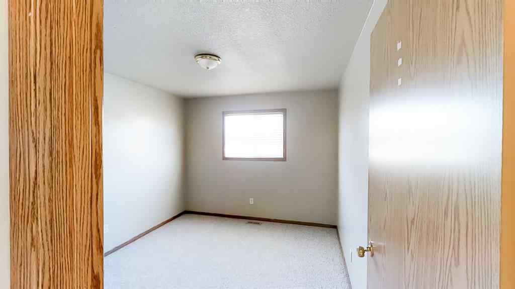 MLS® A2207702 - Unit #C 10029 105 Avenue  in Avondale South Grande Prairie, Residential