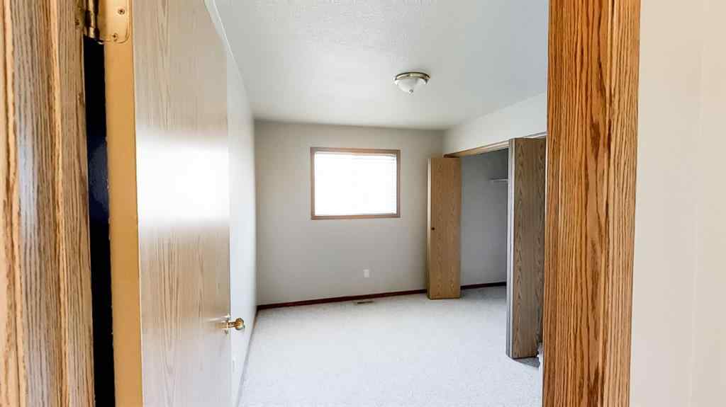 MLS® A2207702 - Unit #C 10029 105 Avenue  in Avondale South Grande Prairie, Residential