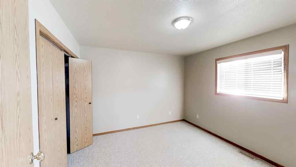 MLS® A2207702 - Unit #C 10029 105 Avenue  in Avondale South Grande Prairie, Residential
