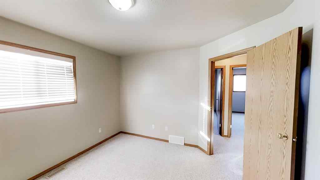 MLS® A2207702 - Unit #C 10029 105 Avenue  in Avondale South Grande Prairie, Residential