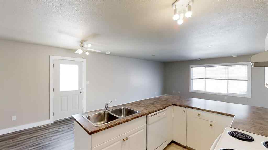 MLS® A2207702 - Unit #C 10029 105 Avenue  in Avondale South Grande Prairie, Residential