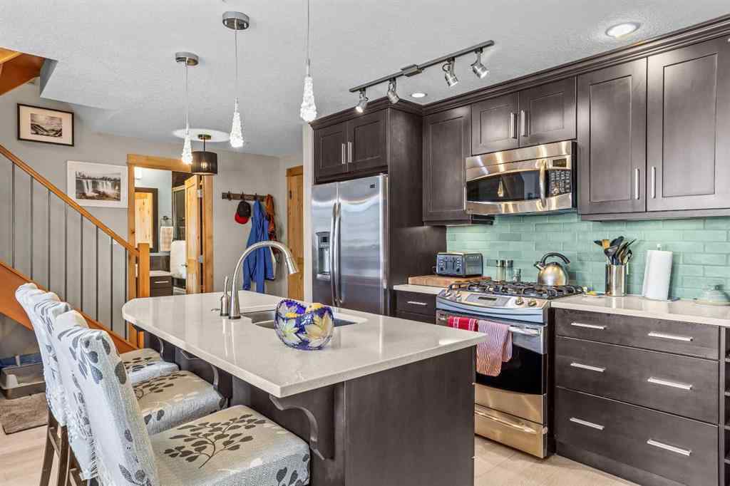 MLS® A2208496 - Unit #304 2100A Stewart Creek Drive  in Three Sisters Canmore, Residential