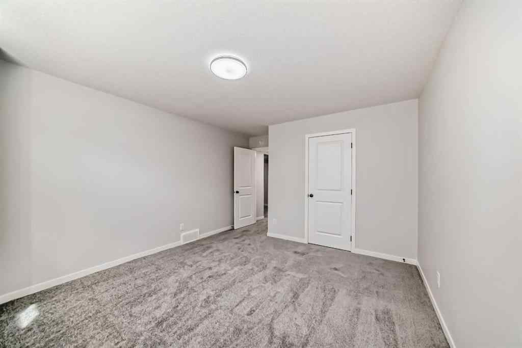 MLS® A2210904 - 208 Lucas Place NW in Livingston Calgary, Residential