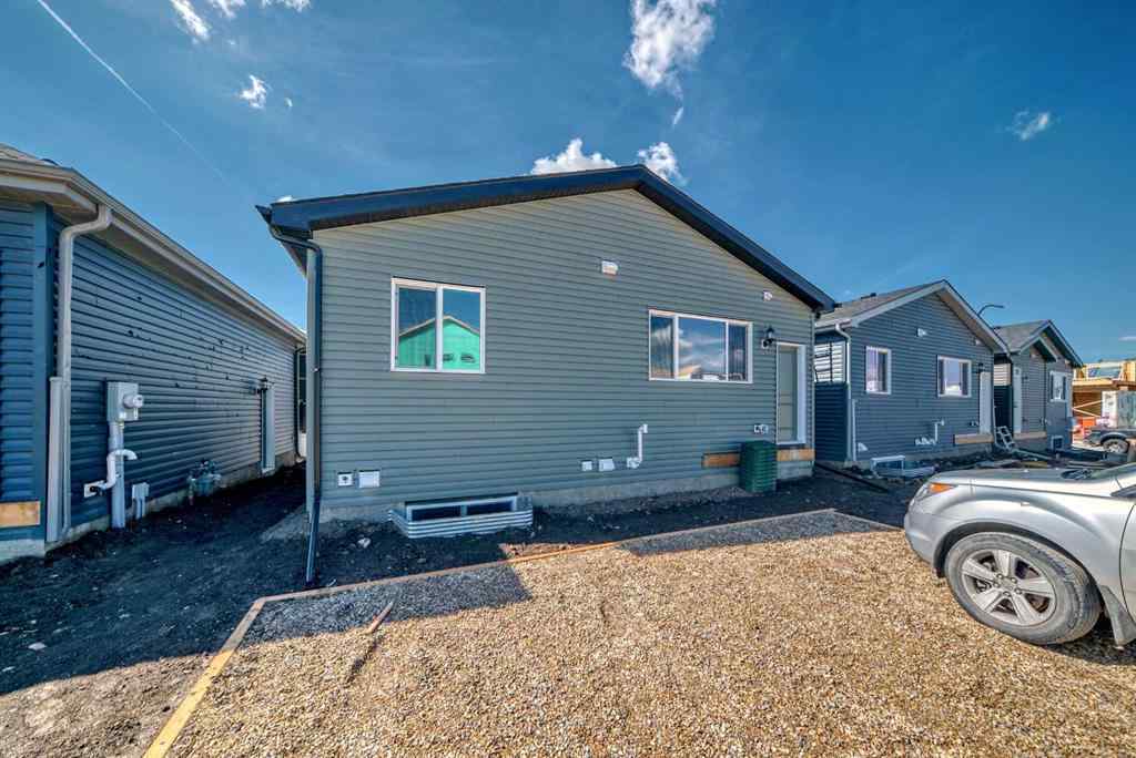 MLS® A2210904 - 208 Lucas Place NW in Livingston Calgary, Residential