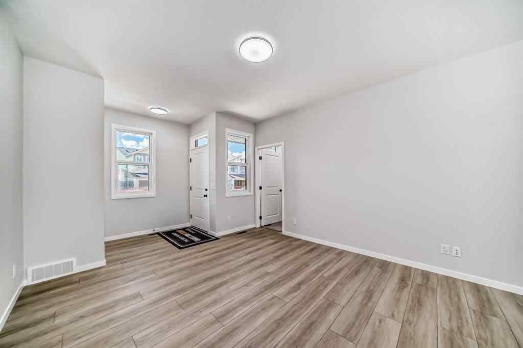 MLS® A2210904 - 208 Lucas Place NW in Livingston Calgary, Residential