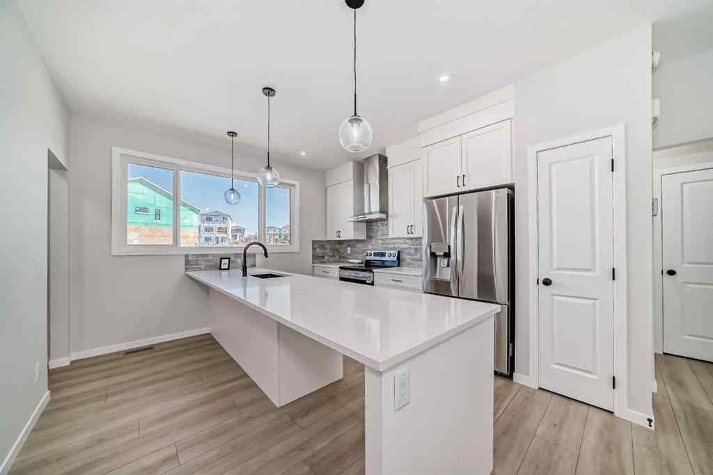 MLS® A2210904 - 208 Lucas Place NW in Livingston Calgary, Residential