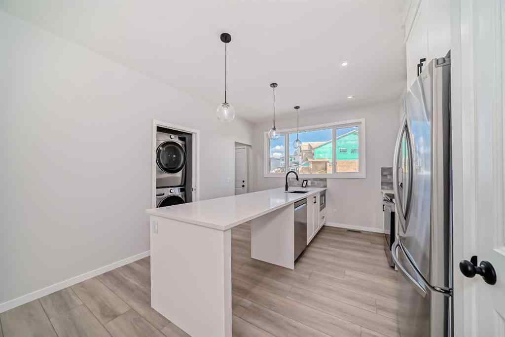 MLS® A2210904 - 208 Lucas Place NW in Livingston Calgary, Residential