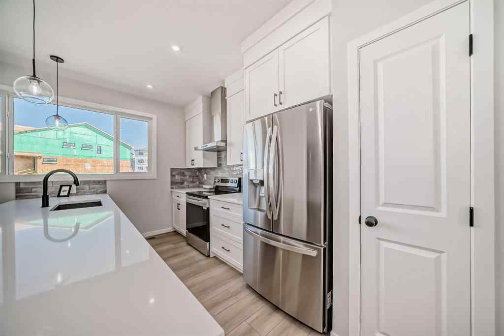 MLS® A2210904 - 208 Lucas Place NW in Livingston Calgary, Residential
