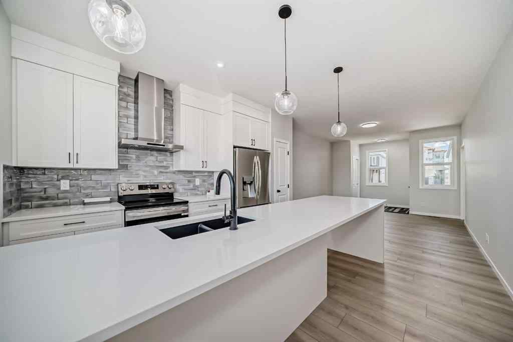 MLS® A2210904 - 208 Lucas Place NW in Livingston Calgary, Residential