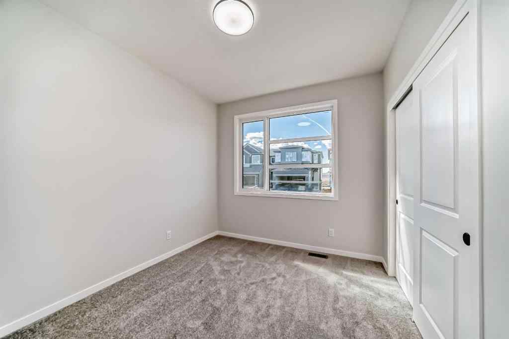 MLS® A2210904 - 208 Lucas Place NW in Livingston Calgary, Residential