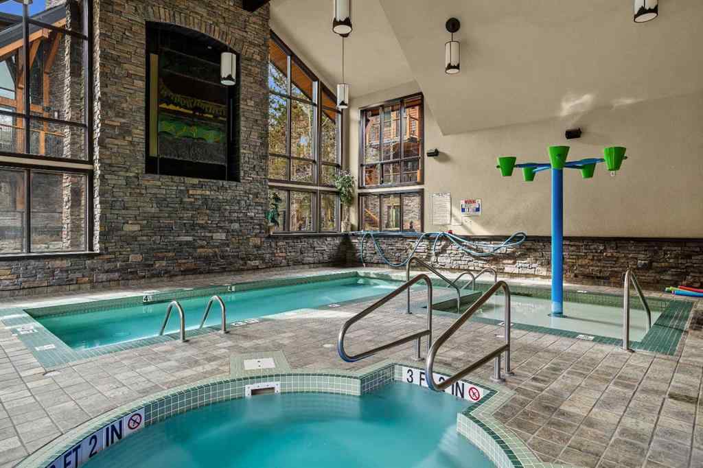 MLS® A2211505 - Unit #1106 101A STEWART CREEK Landing  in Three Sisters Canmore, Residential