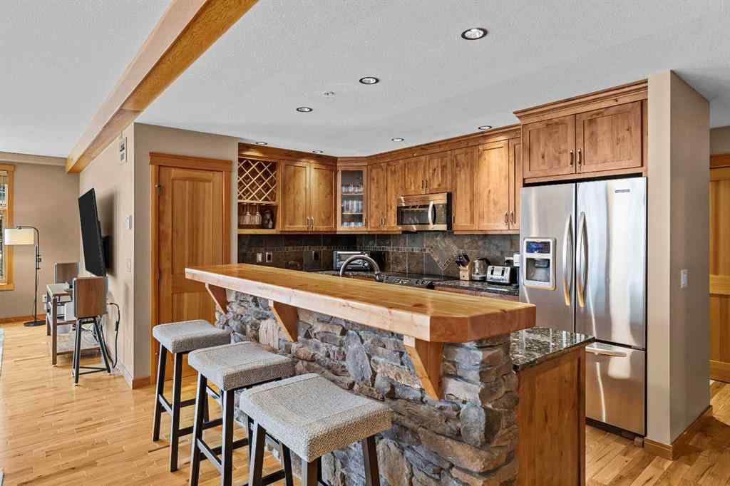 MLS® A2211505 - Unit #1106 101A STEWART CREEK Landing  in Three Sisters Canmore, Residential