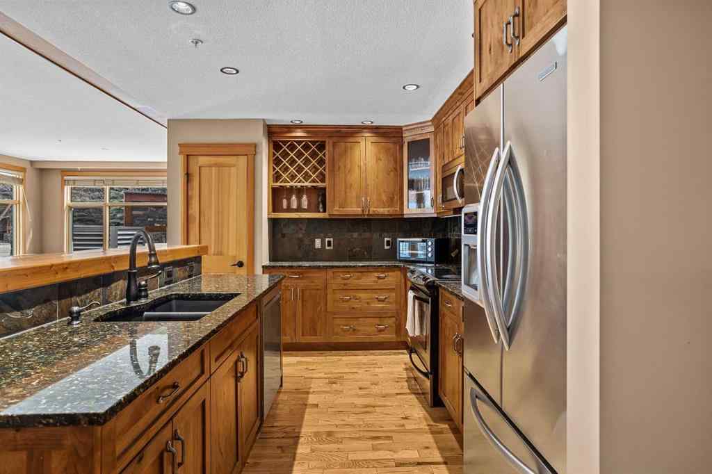 MLS® A2211505 - Unit #1106 101A STEWART CREEK Landing  in Three Sisters Canmore, Residential