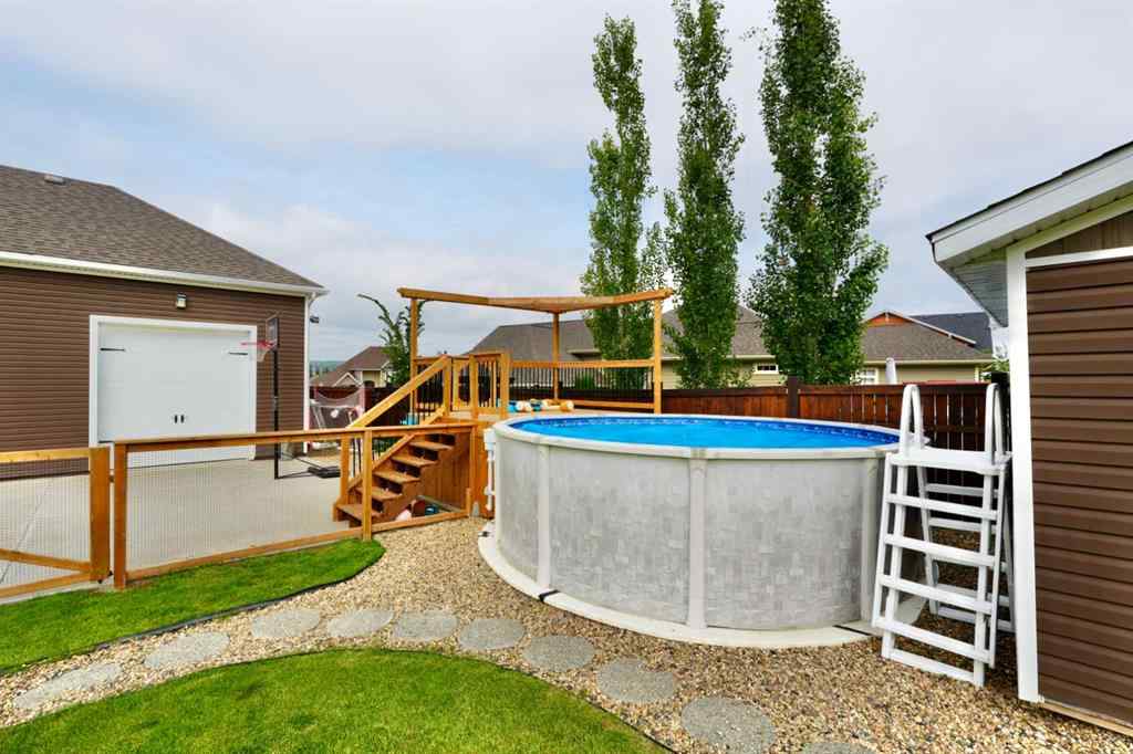 MLS® A2212380 - 10313 86 Street  in Saddleback Ridge Peace River, Residential