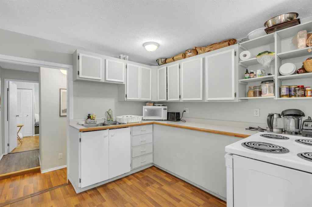 MLS® A2213994 - 4718 College Avenue  in College Heights Lacombe, Multi-Family