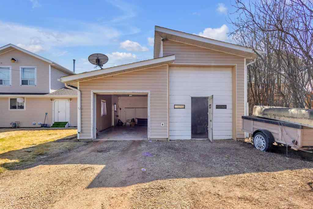 MLS® A2213994 - 4718 College Avenue  in College Heights Lacombe, Multi-Family