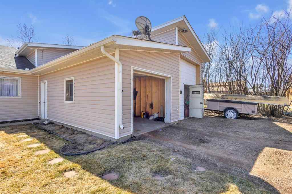 MLS® A2213994 - 4718 College Avenue  in College Heights Lacombe, Multi-Family